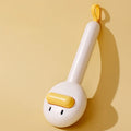 Small yellow duck-shaped pet grooming comb with open section design and needle pins for hair removal