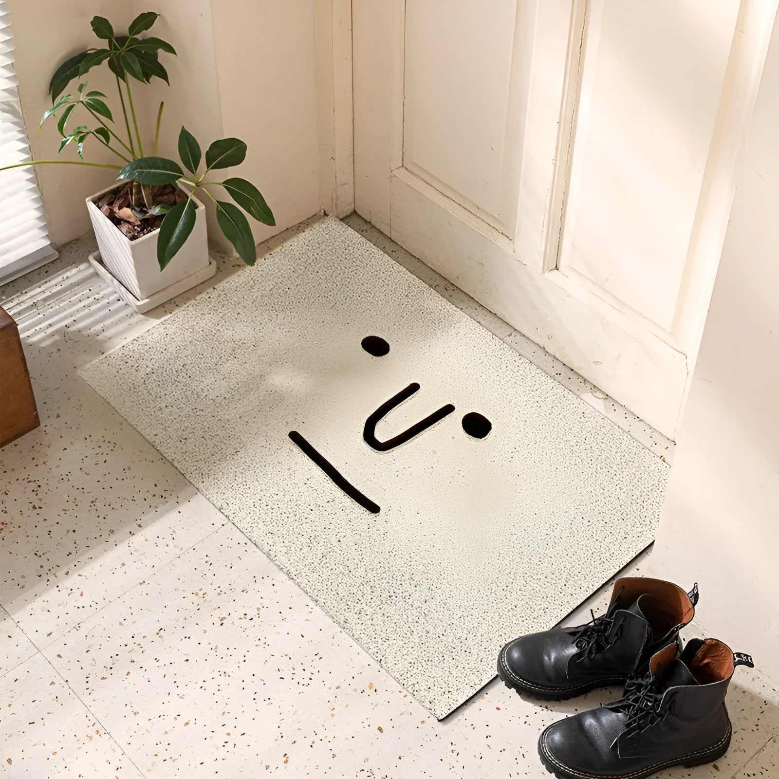 Square PVC floor mat with a cartoon facial expression and geometric pattern in Mr. Big Nose colour.