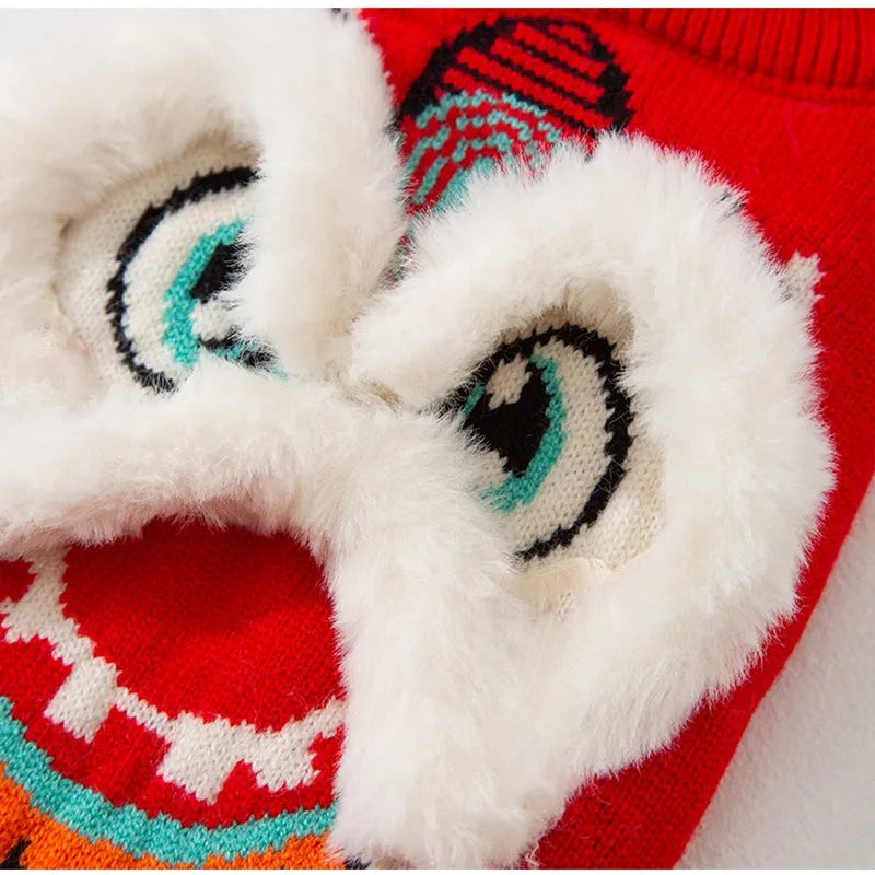 Red knitted lion dance pet sweater with 3D plush face details and colourful embroidery on a cat