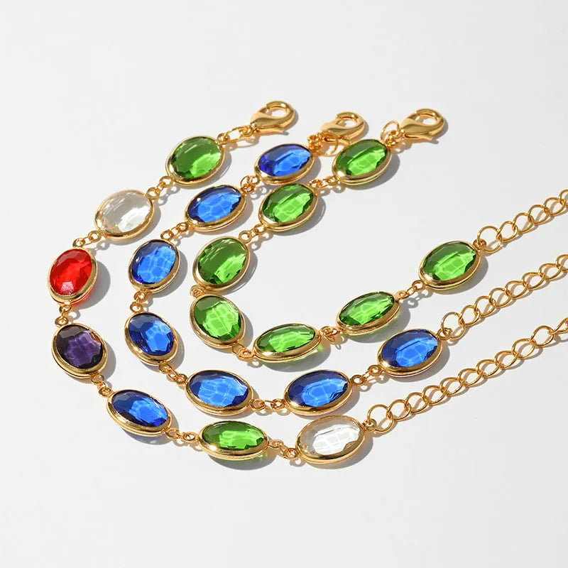 Geometric elliptical women's bracelet with blue glass inlay on an 18K copper band.
