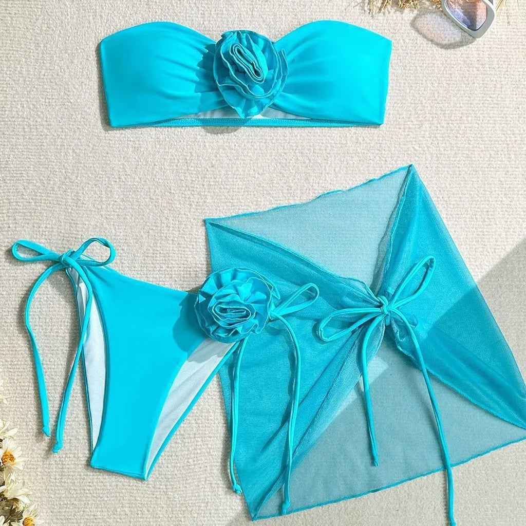 Women's tube top swimsuit with 3D flower detail in blue, pink, or purple colours