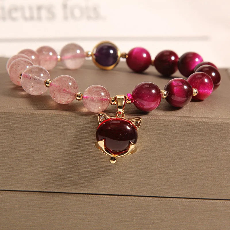 Women's simple bracelet with strawberry crystal beads on elastic rope, showing picture-accurate colour