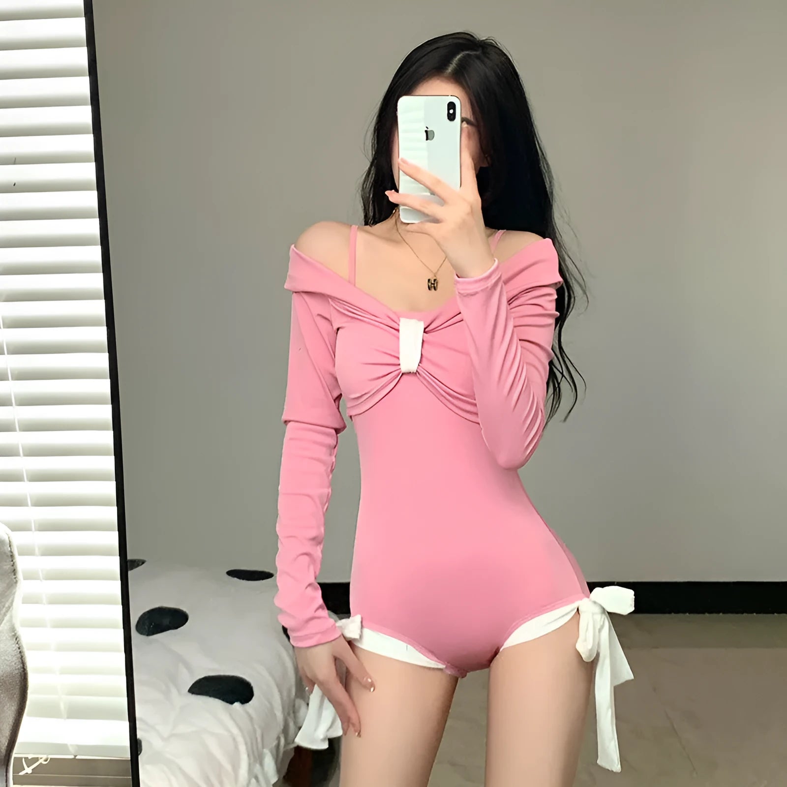 Women's long-sleeved one-piece swimsuit in polyester fabric available in pink and black colours