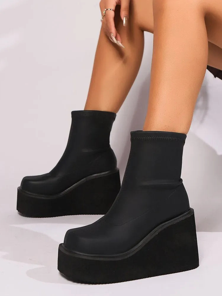 Plus size women's black wedge heel boots with waterproof platform and round toe design