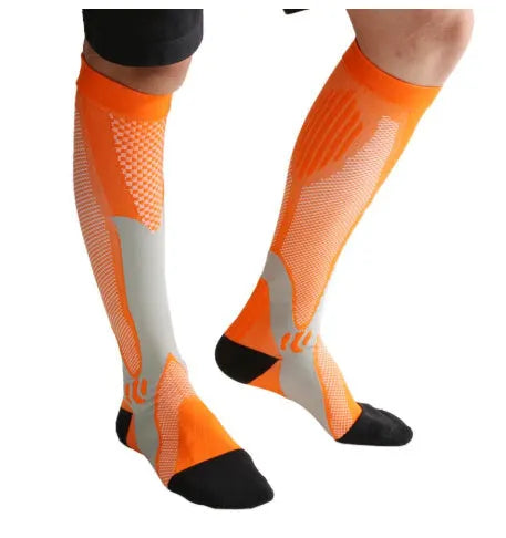 Black graduated compression socks with athletic fit for men and women, shown laid flat.