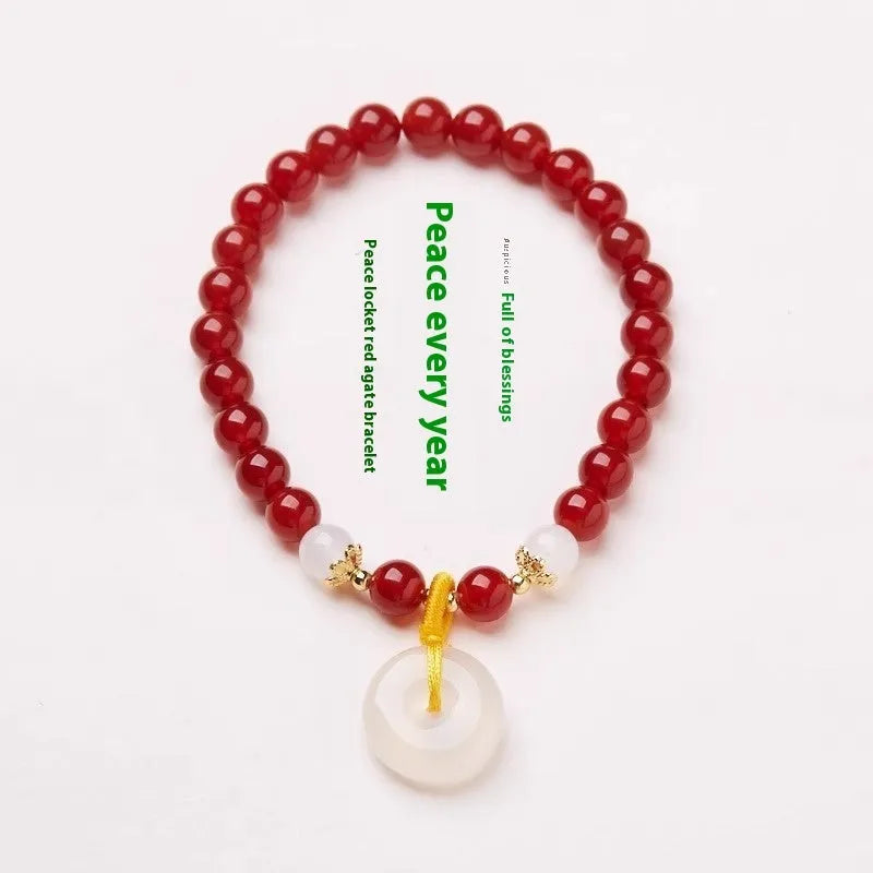 Natural jinsi jade bracelet with peace clasp showing agate and strawberry quartz beads