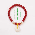 Natural jinsi jade bracelet with peace clasp showing agate and strawberry quartz beads