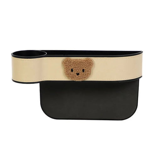 PU leather car seat gap storage box hanging between vehicle seats for small item organisation.