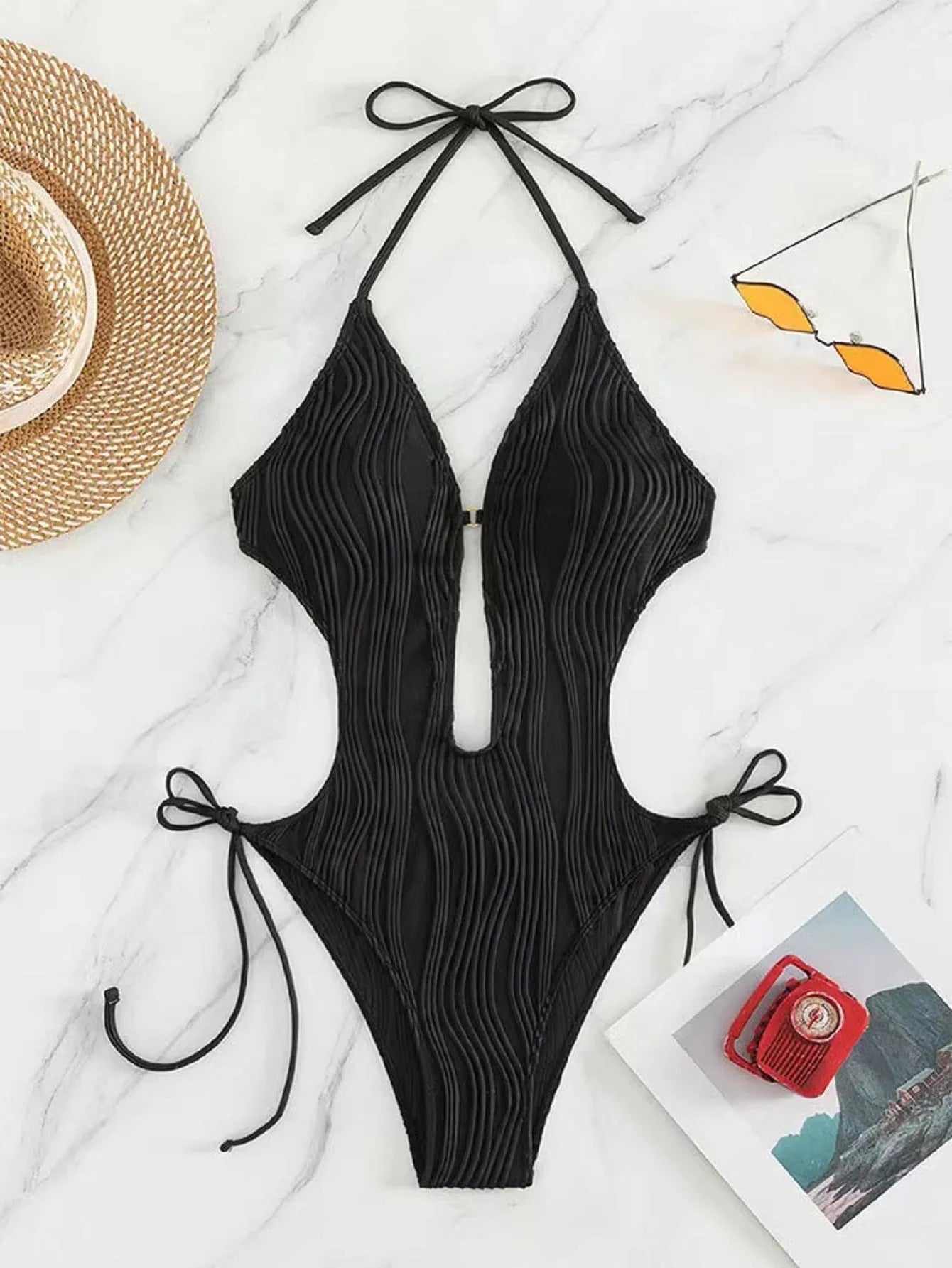 Women's black lace-up triangle bikini swimsuit with tie detail and solid colour design