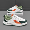 Men's white casual trainers with orange, black, or brown accents and round toe.