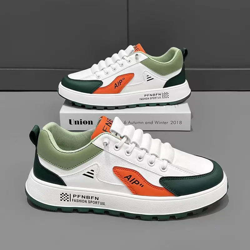 Men's white casual trainers with orange, black, or brown accents and round toe.