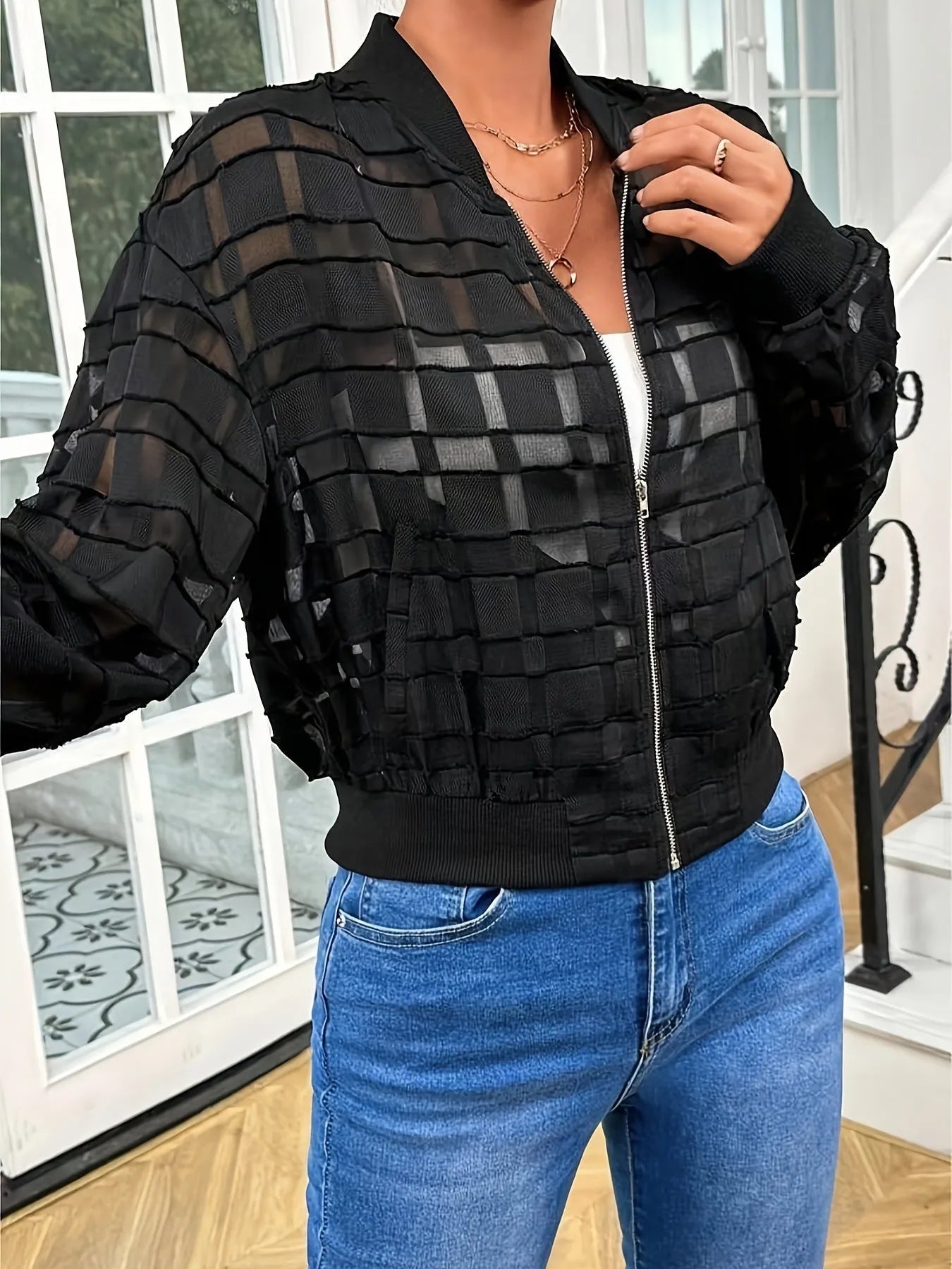 Black women's casual jacket with geometric pattern on semi-transparent polyester fabric featuring front zipper