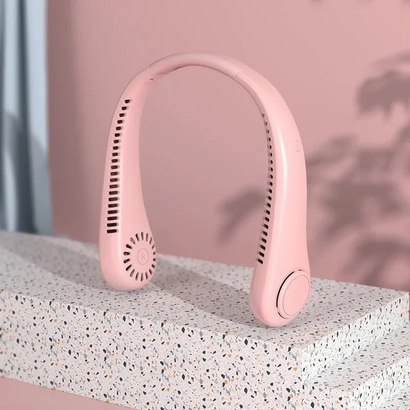 White bladeless neck fan worn around a person's neck, showing the air outlets and flexible neckband.