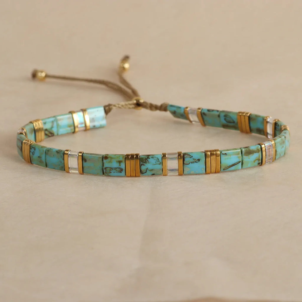 Geometric glass pull bead bracelet in five colour options on wrist