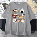 Man modelling a black cotton t-shirt with a colourful cute cat sushi cartoon print on the front.