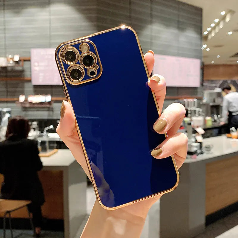 Gold plated iPhone case with silicone stripes in solid colour on an iPhone