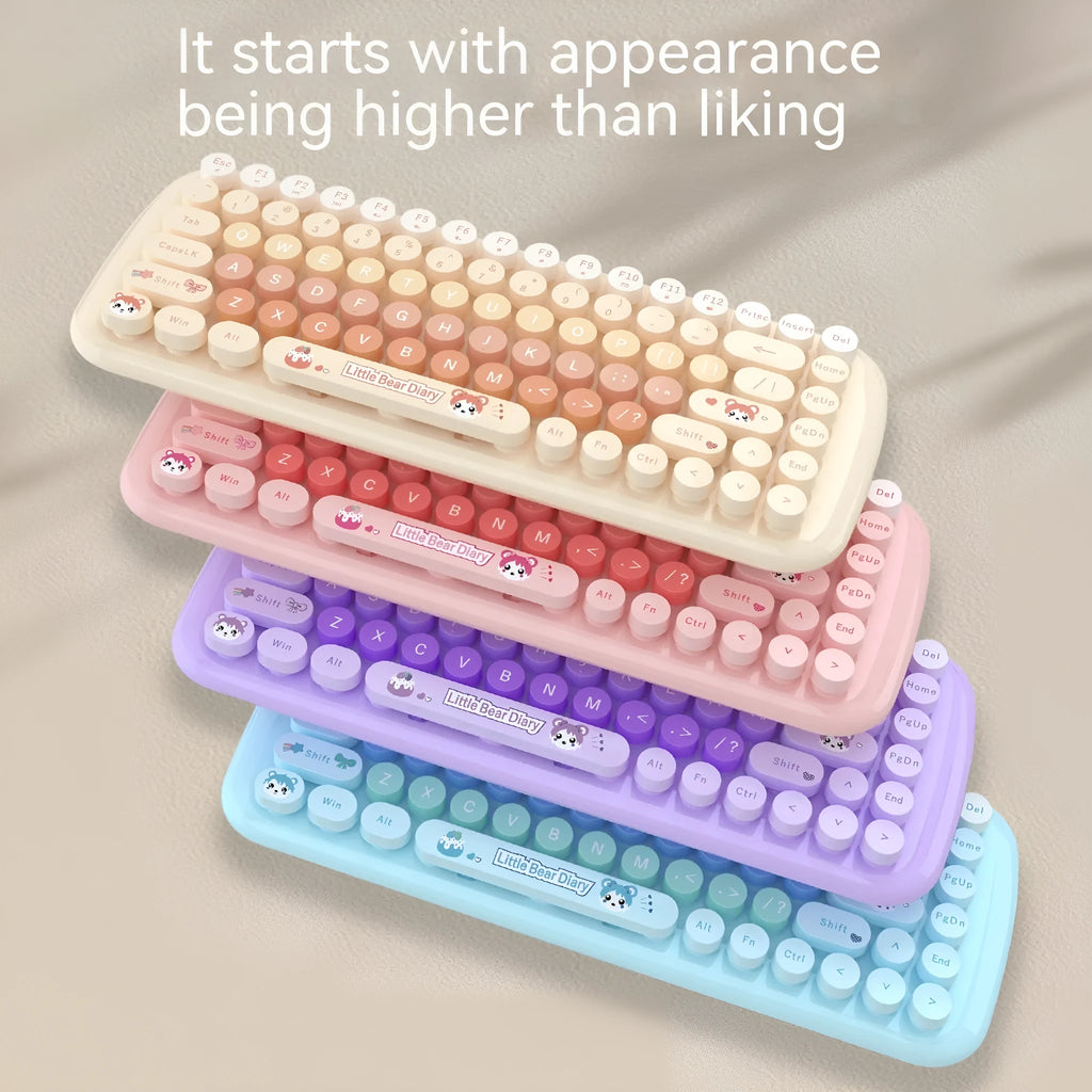 Pink mini wireless keyboard and mouse set with compact design on a desk