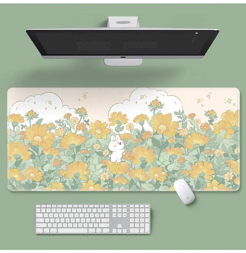 Large flower pattern mouse pad on a desk with keyboard, showing non-slip rubber base and colourful tulip design.