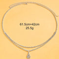 Gold or silver rhinestone waist chain with water drop pendant and tassel detail