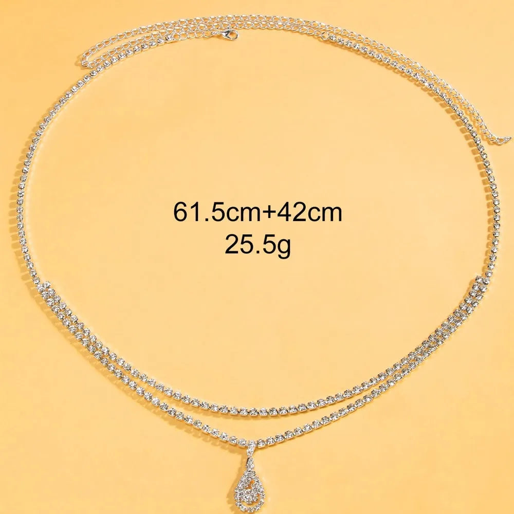 Gold or silver rhinestone waist chain with water drop pendant and tassel detail