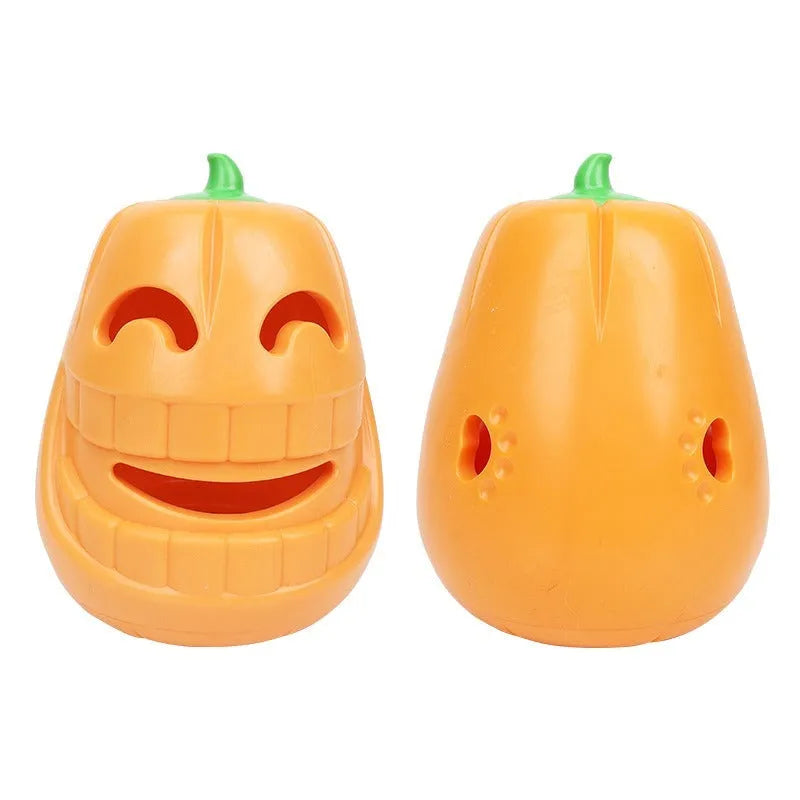 Orange Halloween pumpkin-shaped rubber dog chew toy with a treat-dispensing funnel hole.