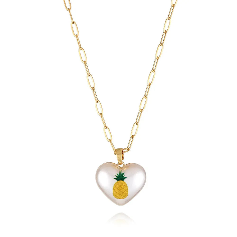 Heart-shaped necklace with a choice of fruit pendant charms on an adjustable chain.