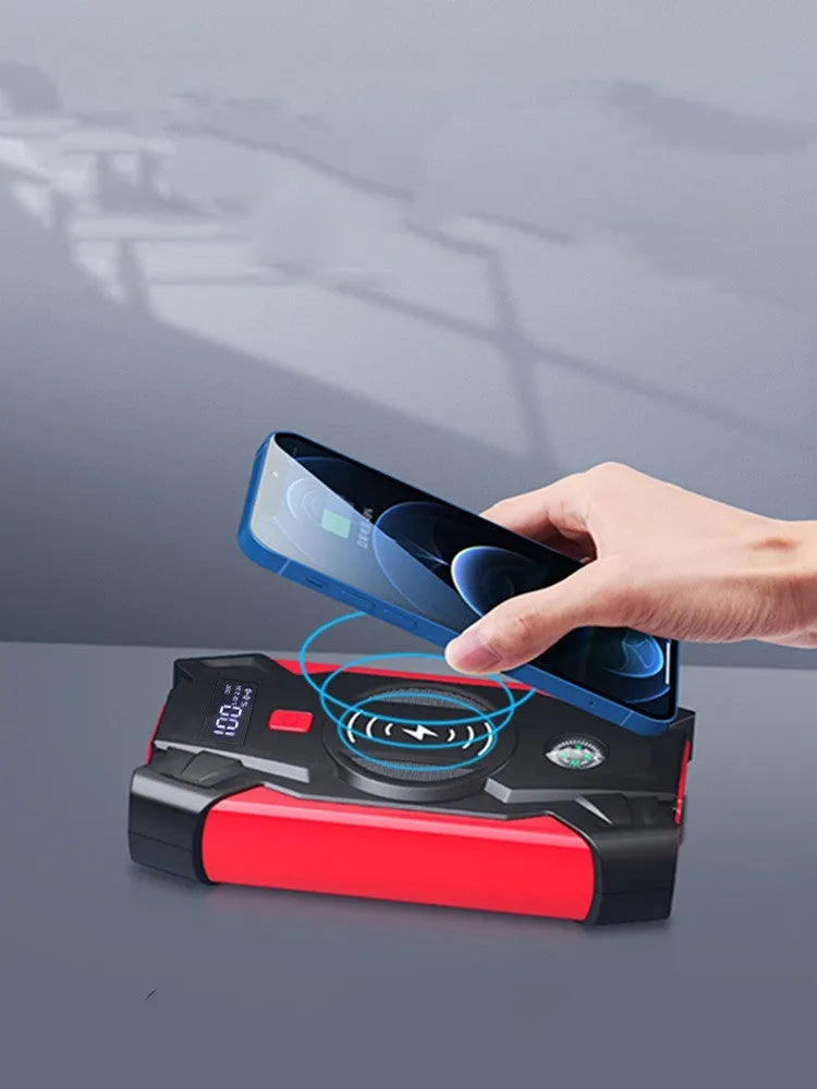 Red car emergency jump starter power bank with digital display and jumper cables