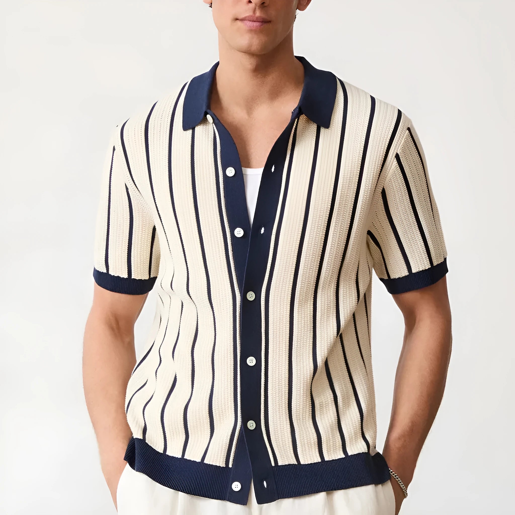 White men's knitted jumper with asymmetric design and striped pattern, featuring a lapel collar and short sleeves.