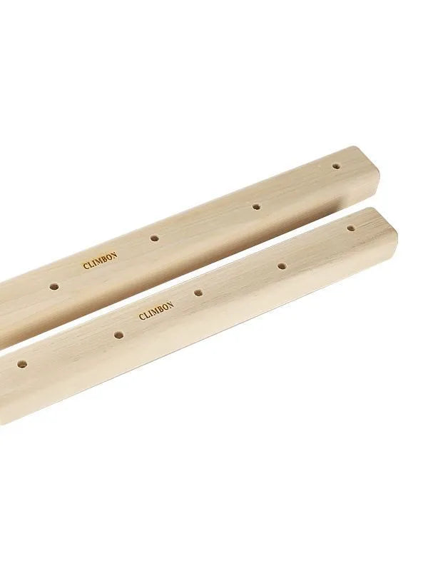 Three wooden hangboards for grip strength training in different lengths mounted for exercise