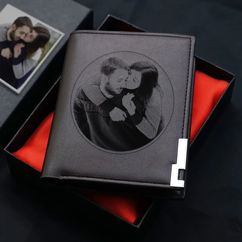 Men's brown leather wallet with a silver zipper closure laid flat.