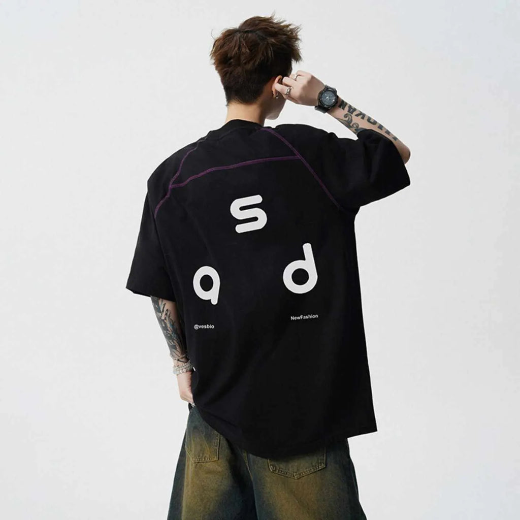 Men's loose fit black cotton t-shirt with a letter print on the front, short sleeves, and a round neck.