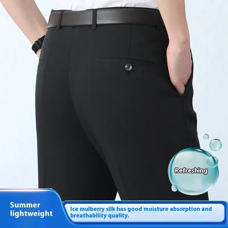 Man wearing black straight-leg high-waisted non-iron business trousers made from a Mulberry Silk blend fabric.