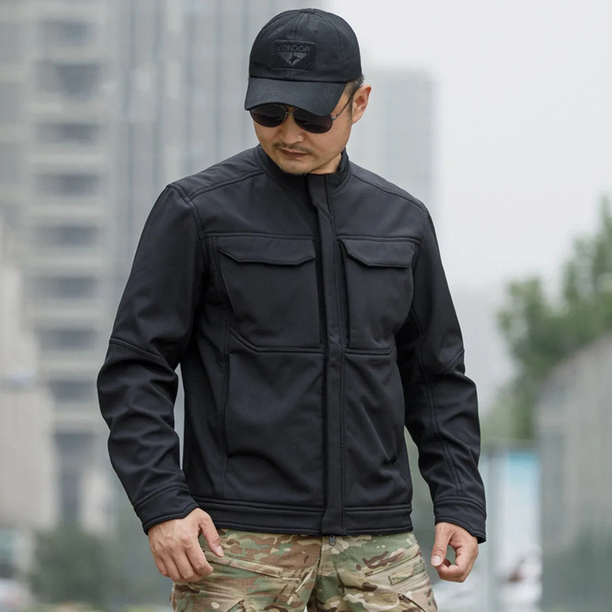 Bone Frog Peak Breaker soft shell tactical jacket in black, shown for outdoor mountaineering use.