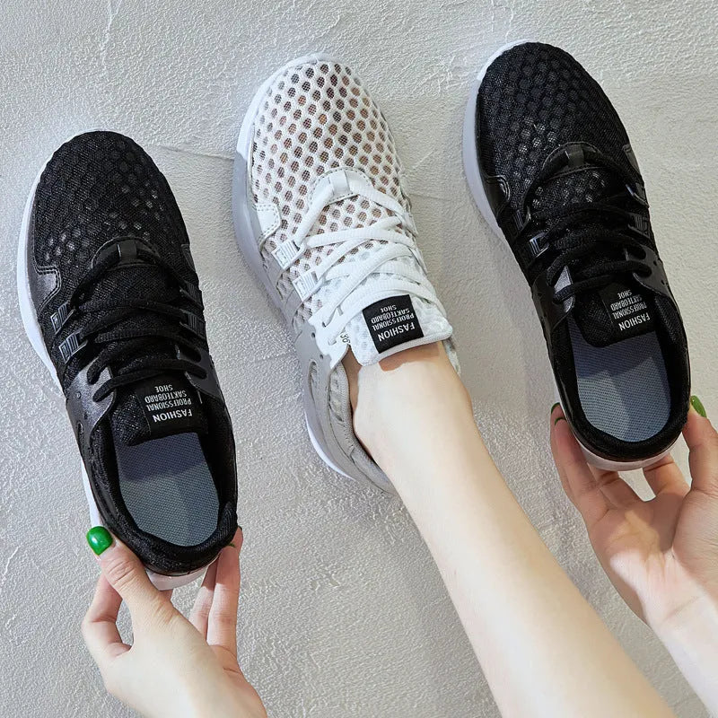 Side view of black hollow breathable mesh sneakers with flat EVA sole and round toe design