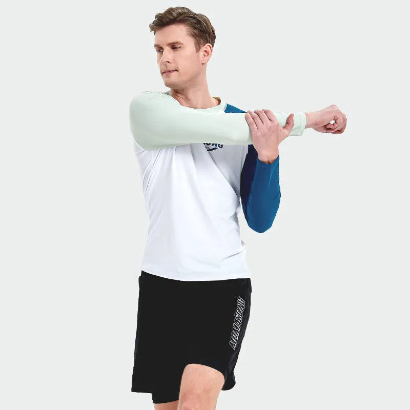 Men's white long-sleeve swim shirt and matching colour block swim trunks set on a man.