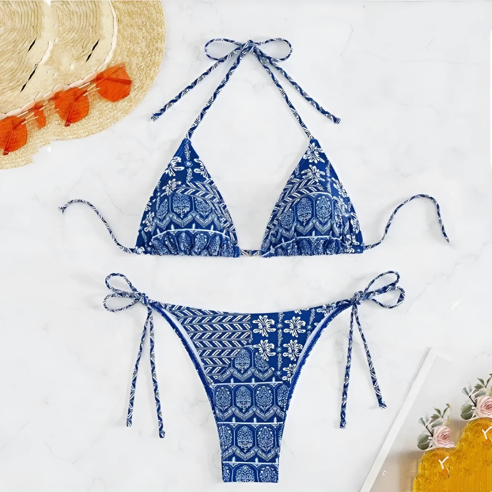 Women's green bandage style bikini swimsuit with split stitching detail on polyester fabric.
