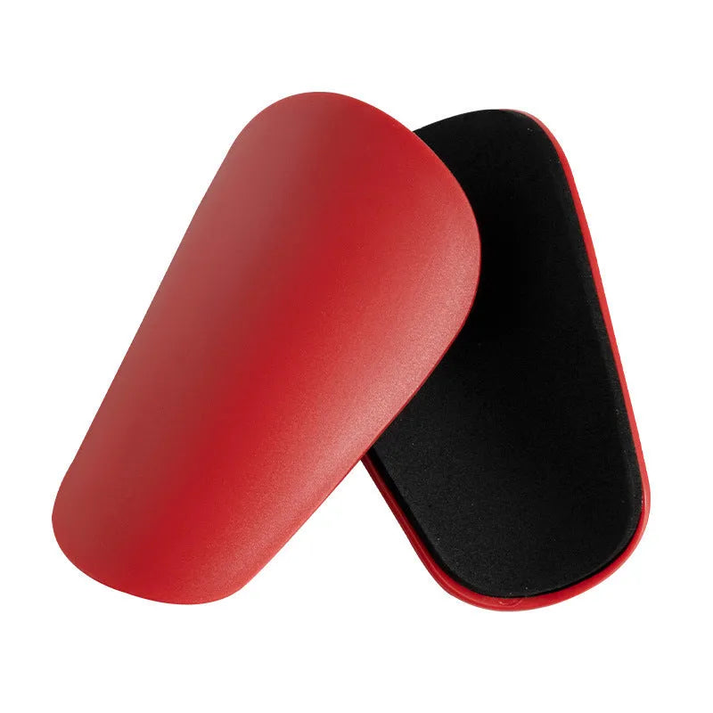 PU mini shin guards for football and sports in black, white, red, and blue colours.