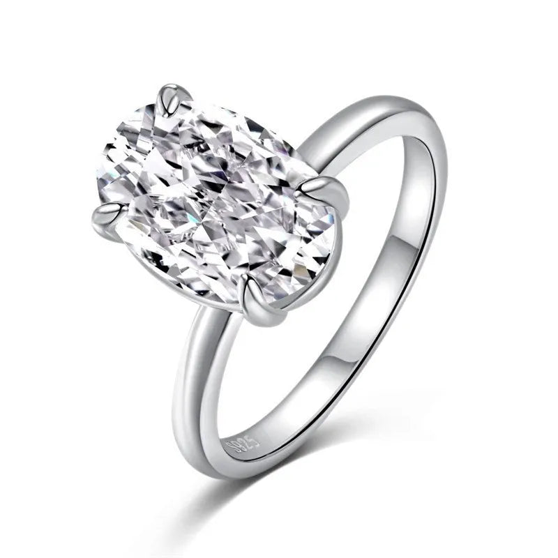 Oval 9 silver women's ring with four-claw setting holding a hand-cut gemstone.