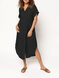 A loose-fitting, solid colour mid-length casual dress with a button-down front and regular sleeves.