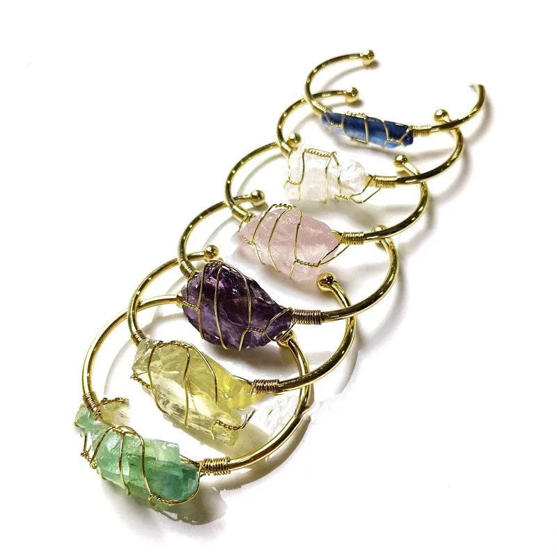 Natural rough crystal stone bracelet with geometric gold tone metal winding, bohemian style.