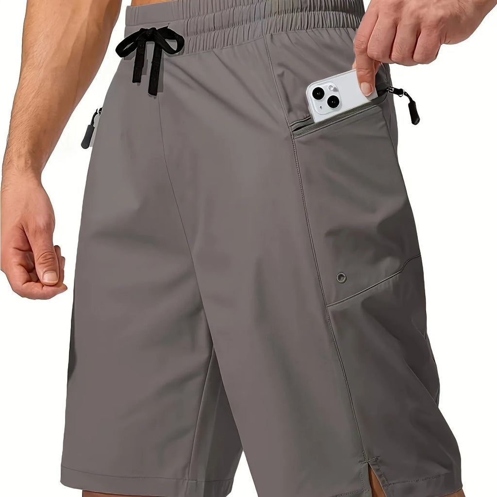 Men's solid colour quick-drying beach shorts in polyester fabric showing straight-leg cut