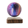 Walnut-coloured magnetic levitation base with a floating, rotating 14cm galaxy moon lamp