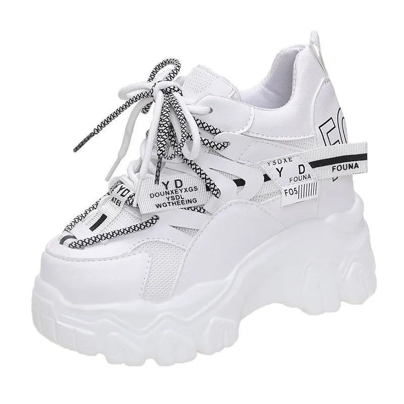 Women's white and black mesh platform sports shoes with cross-strap detail and rubber soles