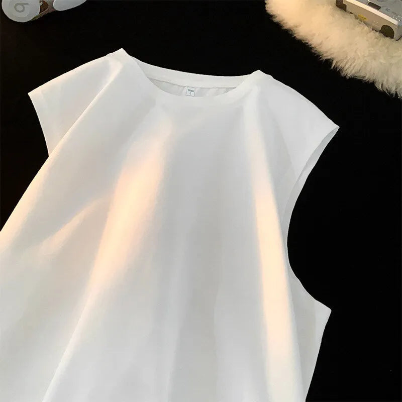 Men's solid colour loose fit cotton tank top on a hanger, showing straight hem and sleeveless design.
