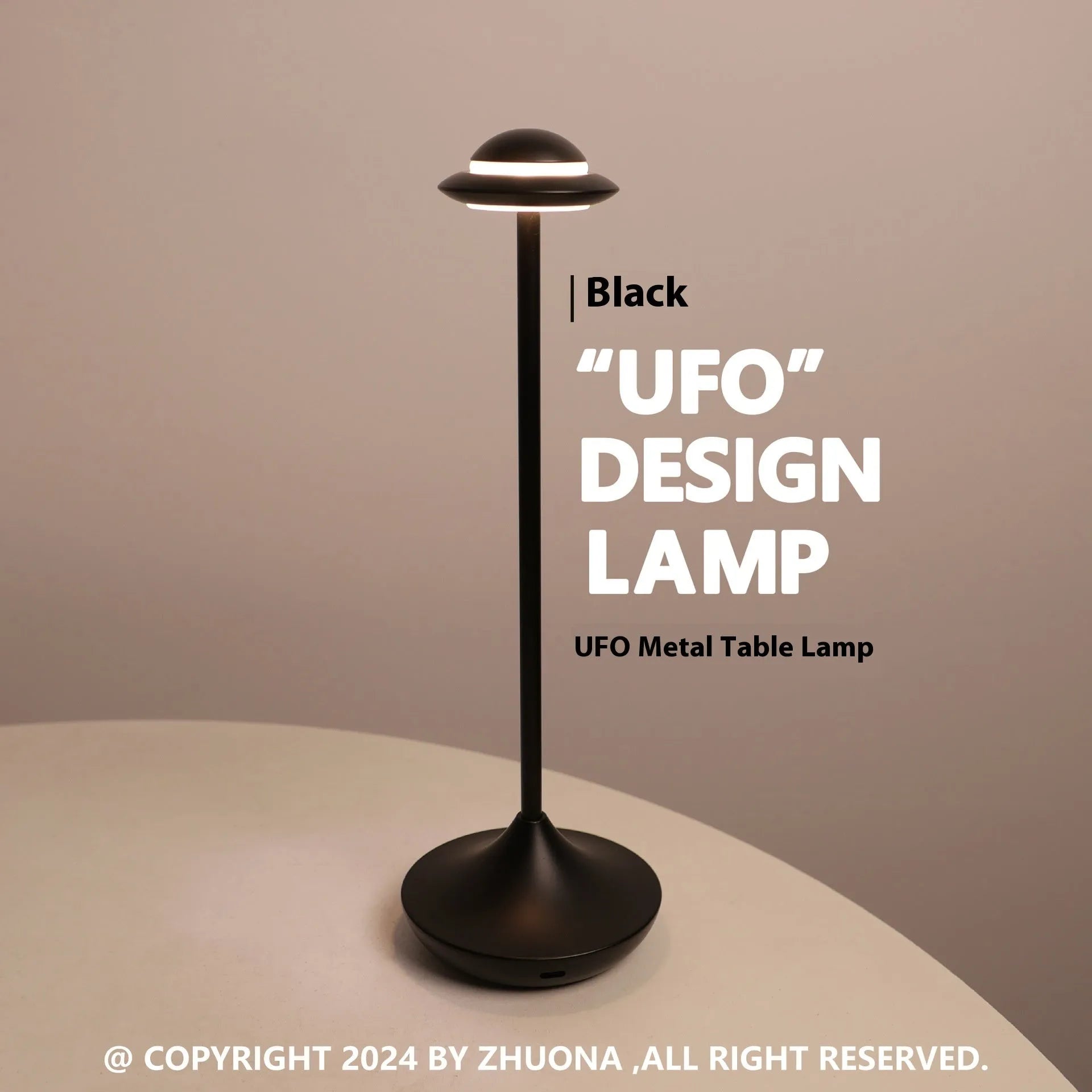 UFO-shaped table lamp with metallic finish and touch controls on desk surface