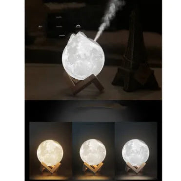White spherical lunar humidifier night light with USB charging cable on a wooden surface.