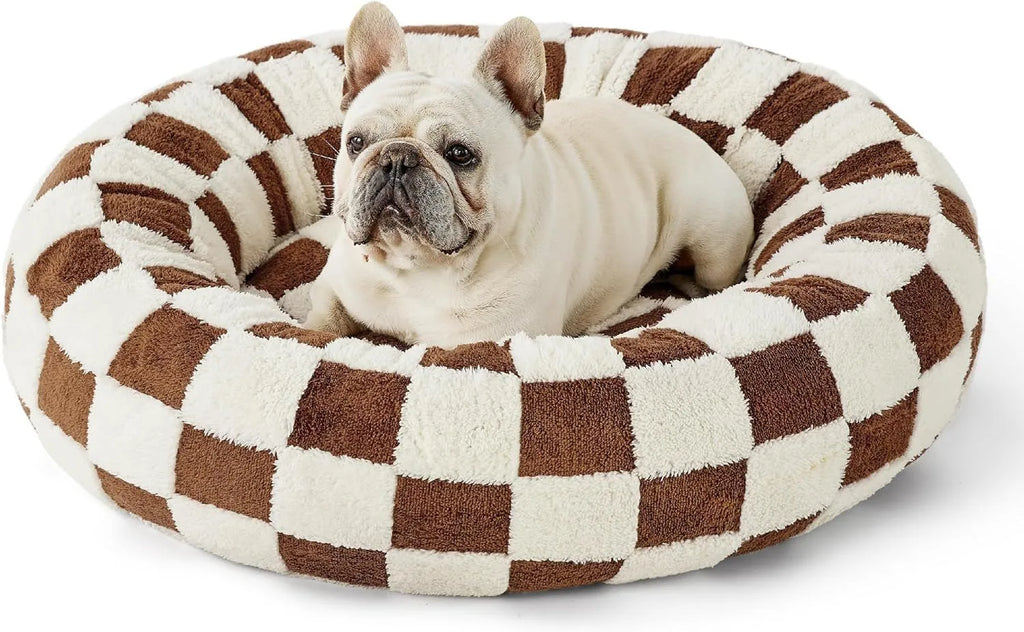 Round blue and white plaid dog bed with a removable cover on a plastic base.