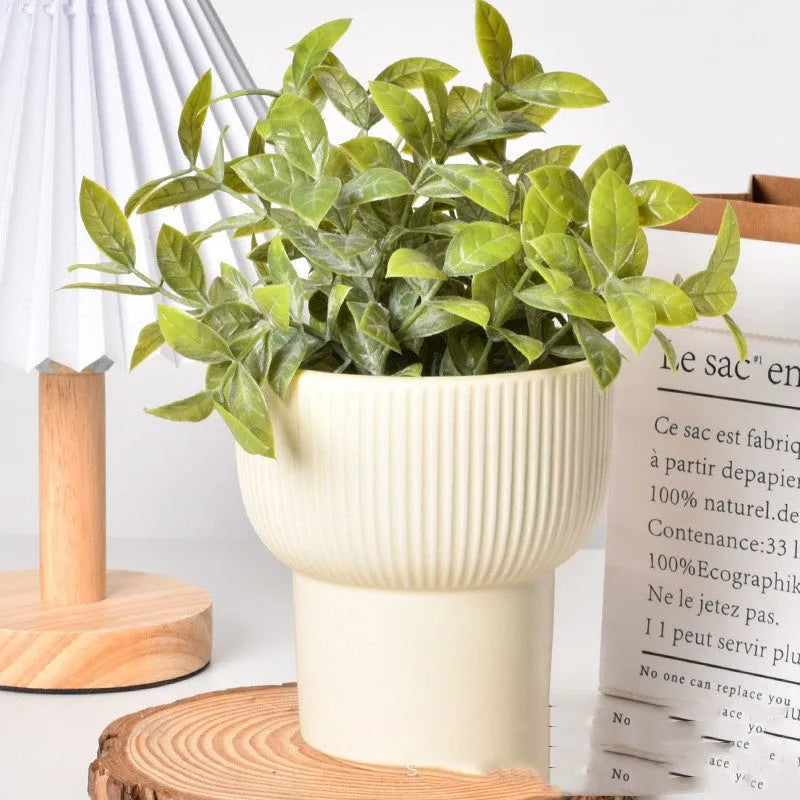 Matte yellow ceramic flower pot with Roman column colour finish for home plant decoration.