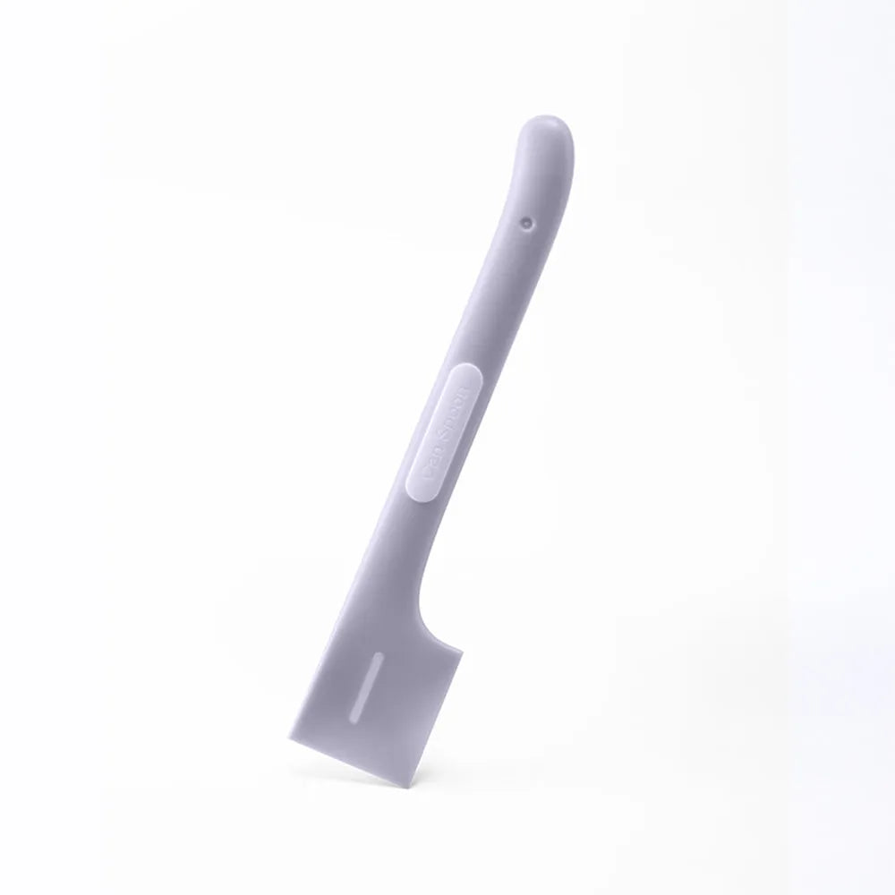 Green long-handle pet feeding spoon for canned cat and dog food on a white background.