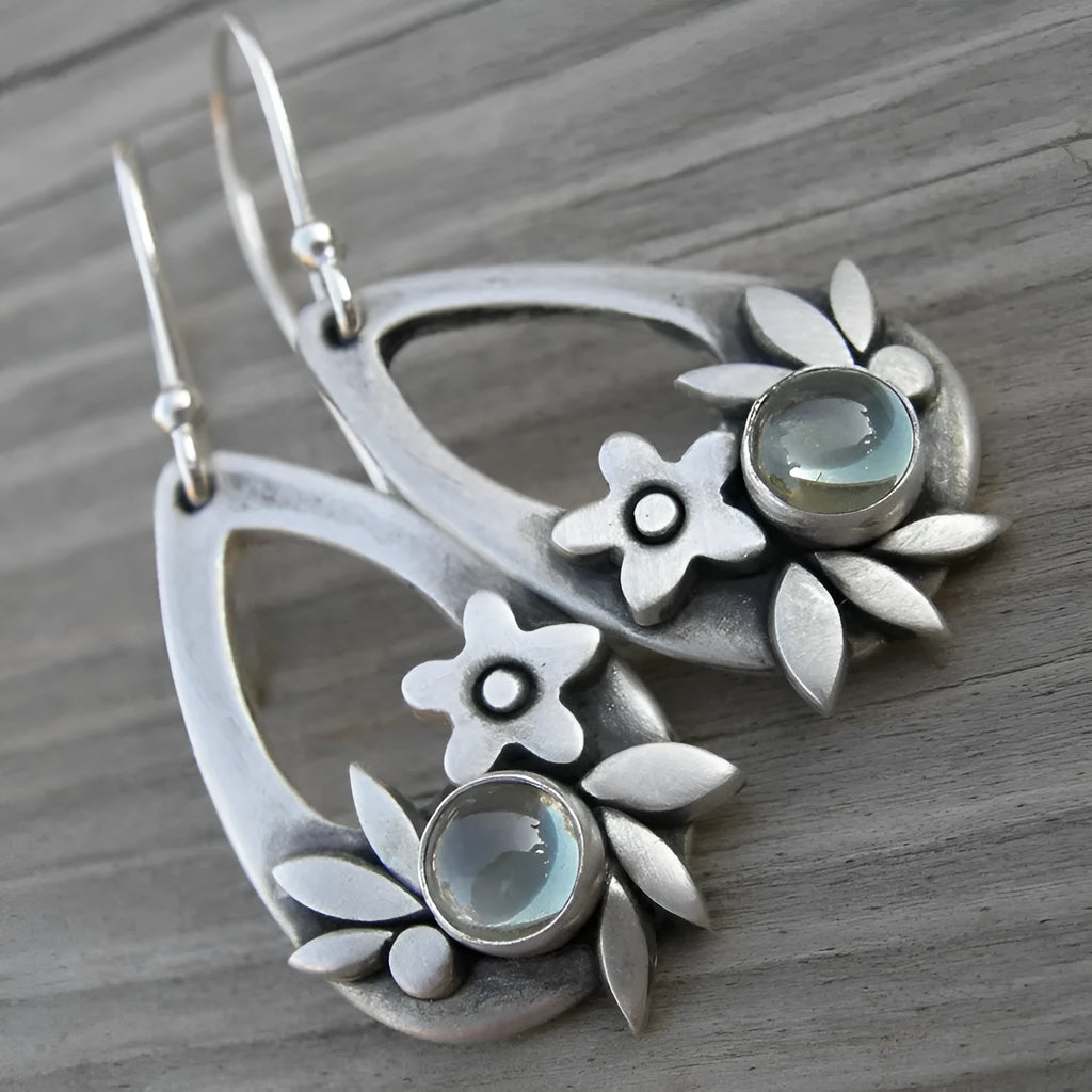 Silver alloy drop earrings with teardrop floral and leaf design